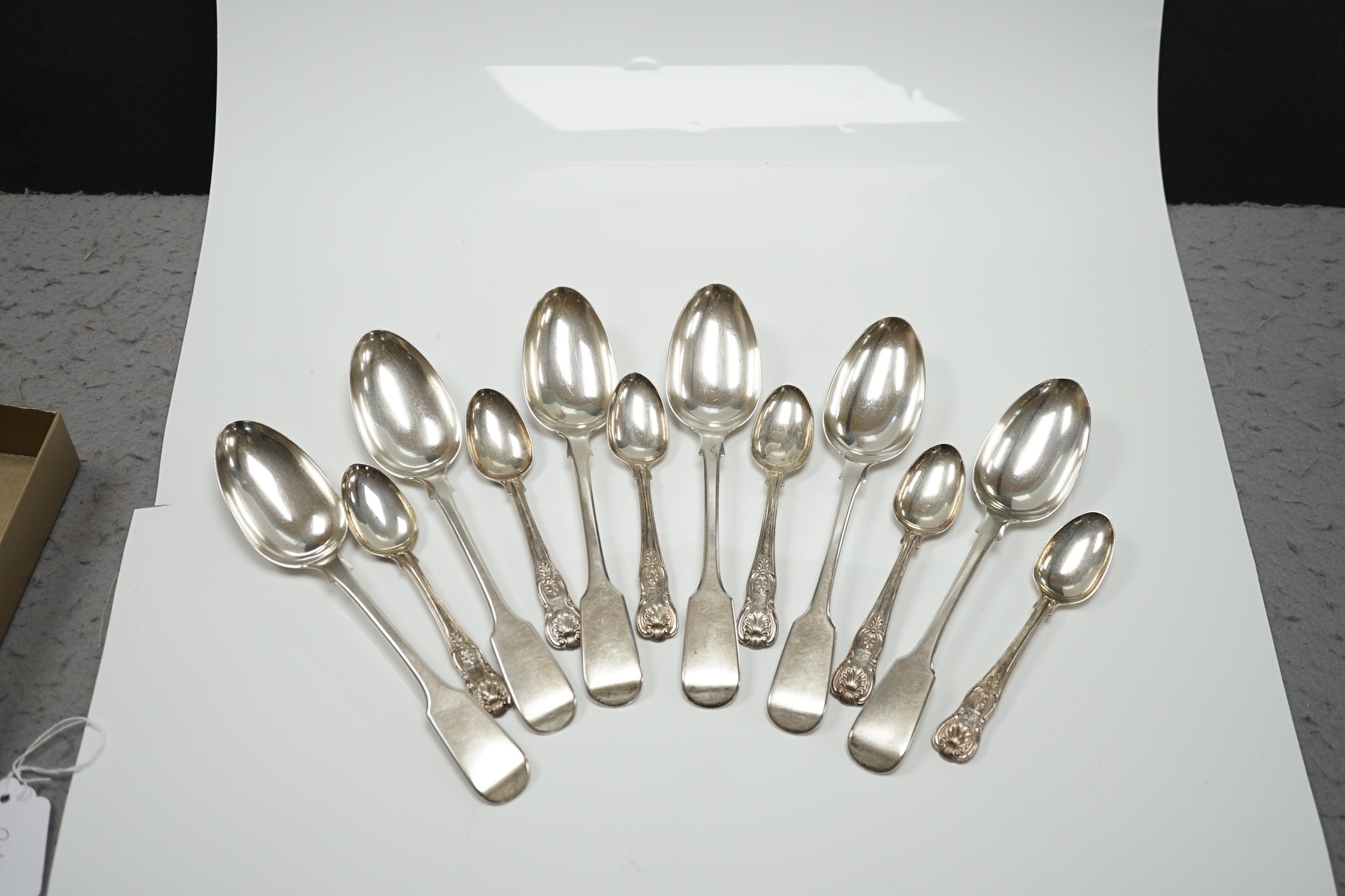 A set of six Victorian silver fiddle pattern table spoons, Samuel Hayne, London, 1863 and a set of late William IV silver King's pattern teaspoons, William Eaton, London, 1836, 21oz.